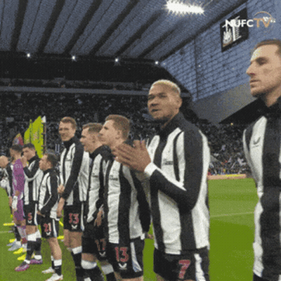 Soccer Players Wearing Black And White Striped Jerseys GIF