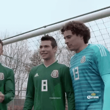 Soccer Players Wearing Green Jerseys With The Number 8 On Them GIF