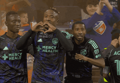Soccer Players Wearing Mercy Health Jerseys Are Celebrating A Goal GIF