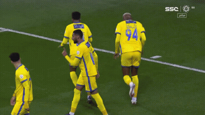 Soccer Players Wearing Yellow Jerseys With The Number 11 And 94 GIF
