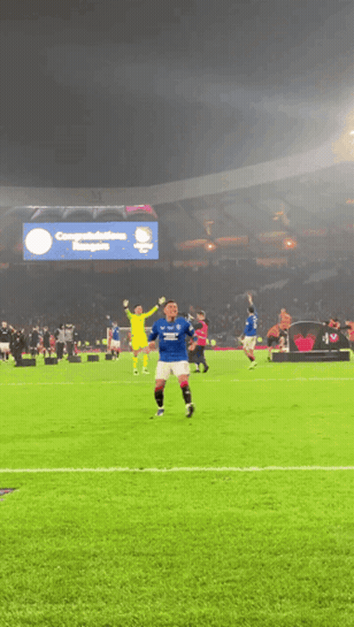 Soccer Players With Congratulations Banner GIF