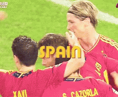 Soccer Players With Yellow Spain Letters GIF