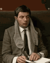 Socks On Ears Mr Bean Waiting And Reading GIF