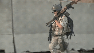 Soldier Carrying Gun Number 23 On Back GIF