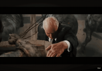 Soldier Holding Another Man In Dark Room GIF