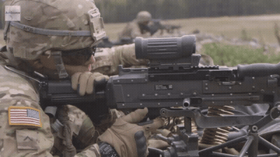 Soldier In AP26 Helmet Holding Machine Gun GIF