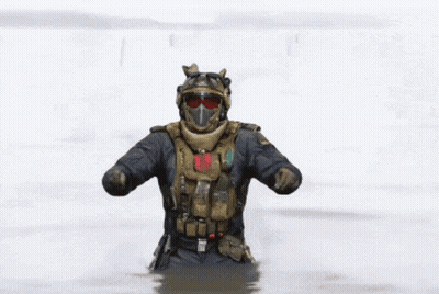 Soldier in Helmet and Goggles Dancing in Water