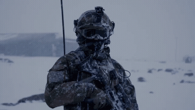 Soldier In Helmet And Goggles Holding Gun In Snow GIF
