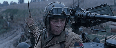 Soldier In Helmet And Goggles Pointing Gun GIF