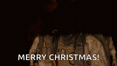 Soldier In Helmet And Goggles Saying Merry Christmas GIF