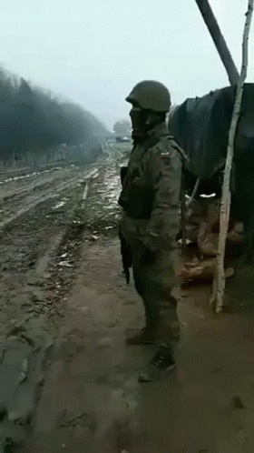 Soldier On Side Of Dirt Road GIF