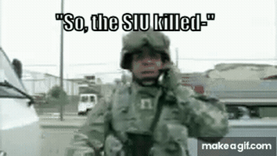 Soldier Talking On Cell Phone By White Van GIF