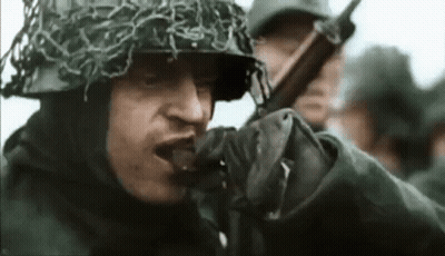 Soldier Wearing Helmet And Gloves Holding Gun GIF