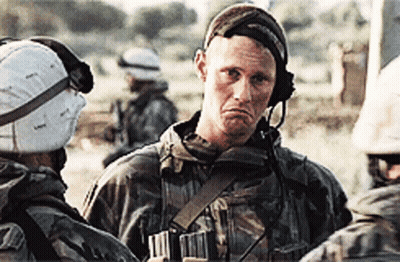 Soldier With Helmet And Headphones Talks To Another GIF