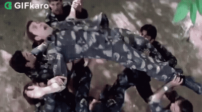 Soldiers Carrying Soldier In Air GIF