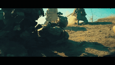 Soldiers Fighting In Dirt With One Laying Down GIF
