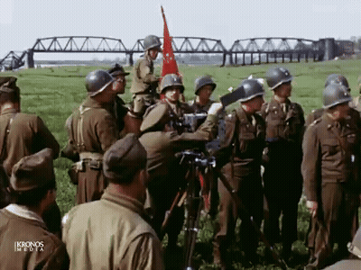 Soldiers Gathered in Field With Ikronos Media