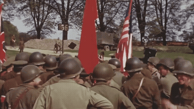 Soldiers Gathered In Front Of Sign Saying 155 GIF