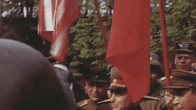 Soldiers Holding Red Flags GIF