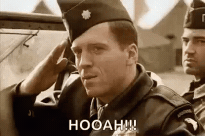 Soldiers In A Boat With Ship In Background GIF