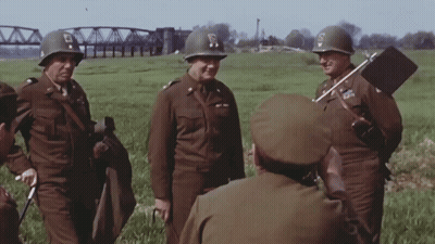 Soldiers in Field With S on Helmet