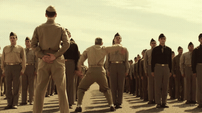 Soldiers Kicking Another Soldier GIF