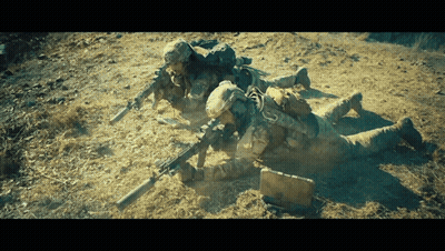 Soldiers Laying In Dirt With Guns GIF