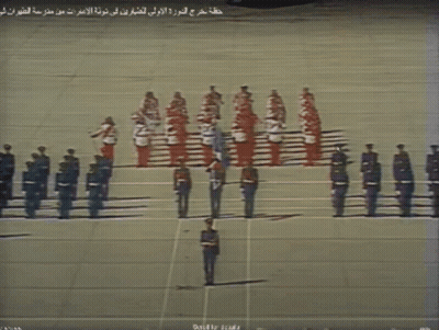 Soldiers Lined Up With Arabic Writing GIF