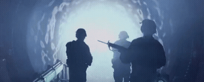 Soldiers Looking At Light In Tunnel GIF