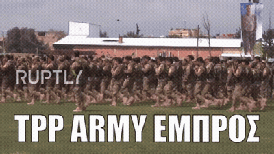 Soldiers Marching In Field With Ruptly Text GIF