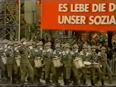 Soldiers Marching In Front Of Banner Es Lebe Die D Unser Sozia GIF