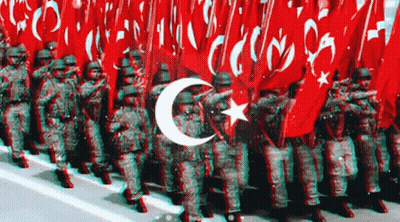 Soldiers Marching In Front Of Crescent Moon And Star Flag GIF