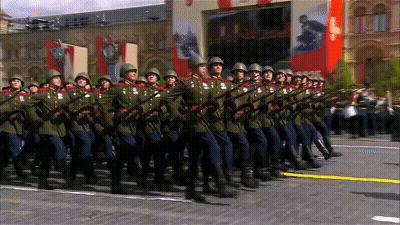 Soldiers Marching In Front Of Russia Sign GIF