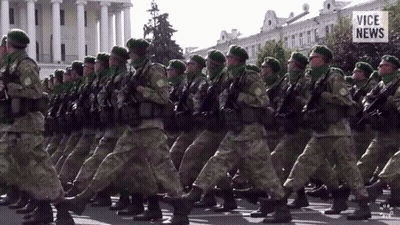 Soldiers Marching In Front Of Vice News Building GIF