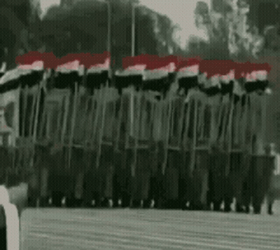 Soldiers Marching In Parade With Flags GIF