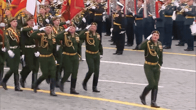 Soldiers Marching With Badge Saying A GIF
