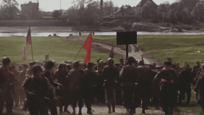 Soldiers Marching With Red Flag GIF
