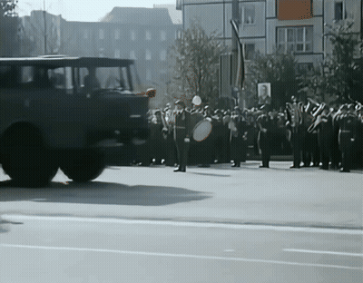 Soldiers Marching With Sign Saying A GIF