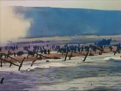 Soldiers On Beach With Barbed Wire GIF