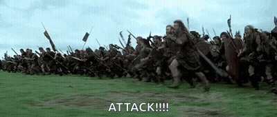 Soldiers Running Through Grassy Field In Battle GIF