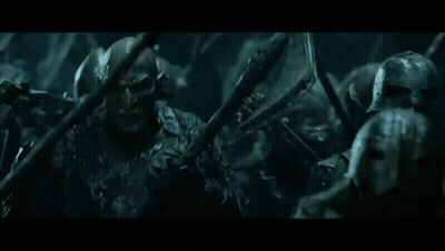 Soldiers Standing In Dark Room Holding Spears GIF