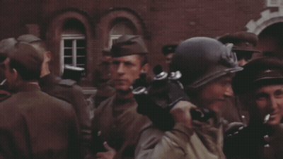 Soldiers Standing In Front Of Building With Helmet And Goggles GIF