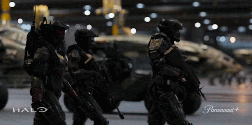 Soldiers Standing In Front Of Halo Vehicle GIF
