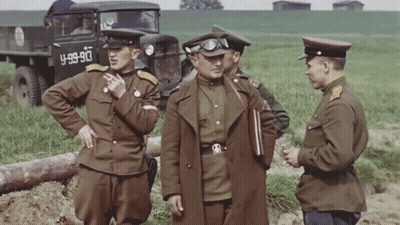 Soldiers Standing In Front Of Truck Saying 4-99-90 GIF