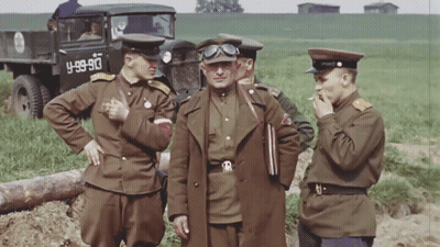 Soldiers Standing In Front Of Truck With License Plate Y-89-90 GIF