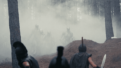 Soldiers Standing in Woods With Smoke
