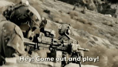 Soldiers Standing on Hill Holding Guns