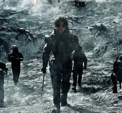 Soldiers Walking Down Dirt Road Holding Guns GIF