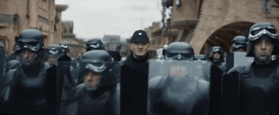 Soldiers With Helmets And Shields In Line GIF