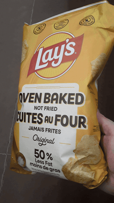 Someone Holding Bag Of Oven Baked Chips GIF